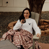 woman cozy with a cup of tea in organic cotton long sleeve