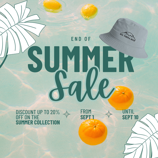 Summer sale advertisement with oranges, a hat, and promotional text on a light blue background.