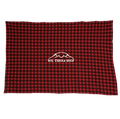 Red and black checkered blanket with a logo on a white background