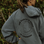 organic cotton hoodie with "the earth is what we all have in common" design