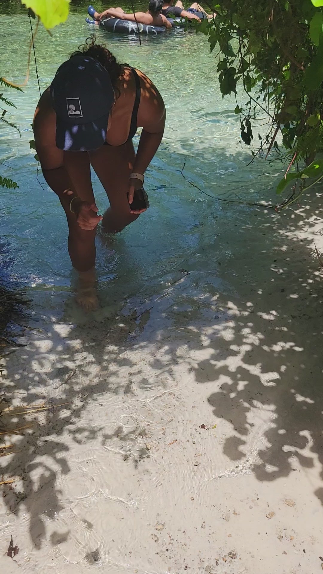 girl walking through trees in the water, wearing hemp hat by Sol Terra Shop
