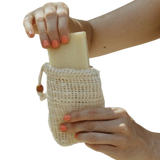 woman putting soap in a soap saver