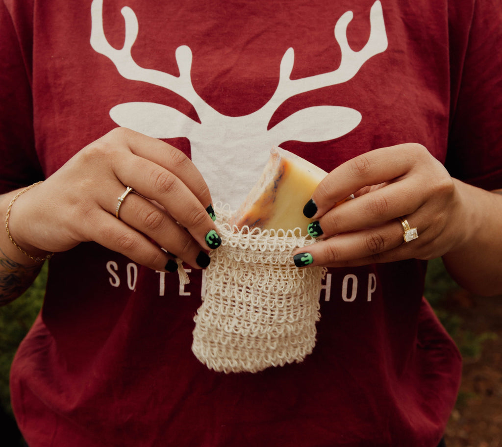 girl putting soap in the soap saver