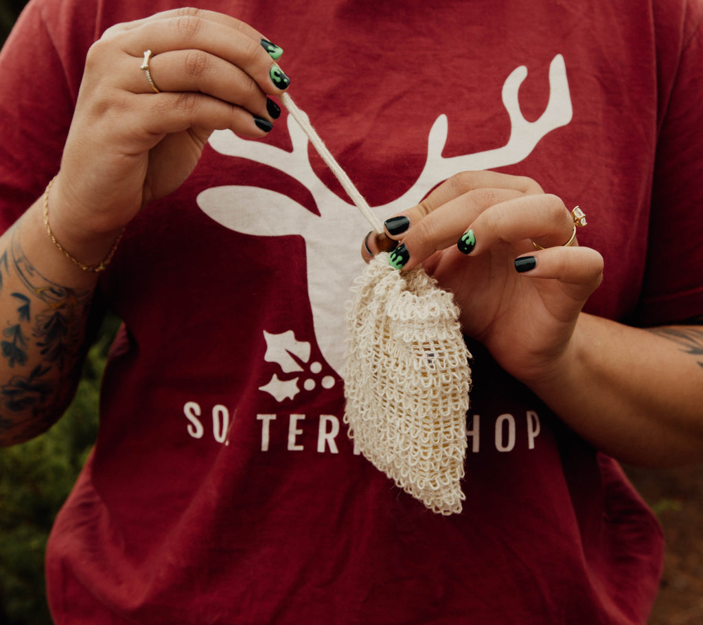 girl closing soap saver bag