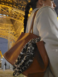 lady carrying caramel bag in paris