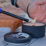 soy candle being lit with a lighter